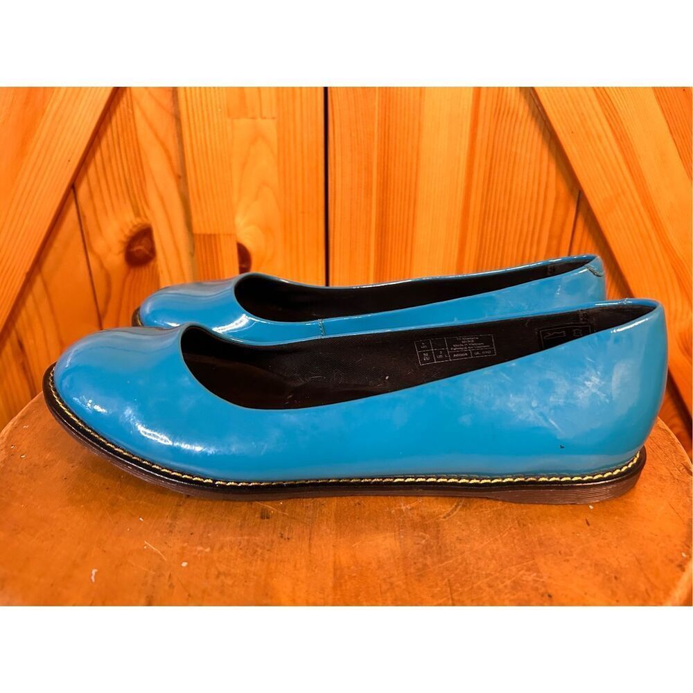 Dr. Martens Glossy Blue Flats